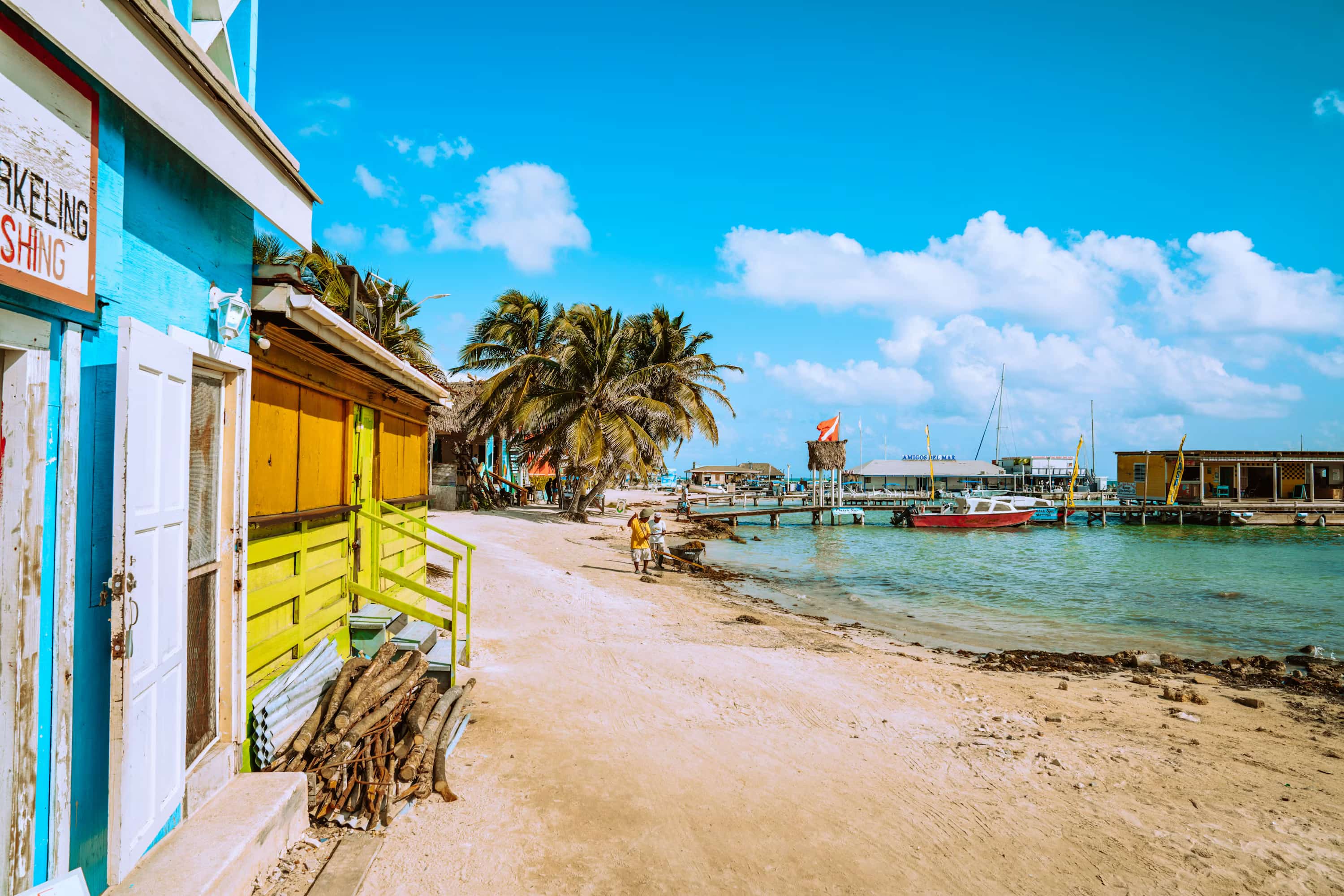 brown wooden beach chairs near body of water during daytime