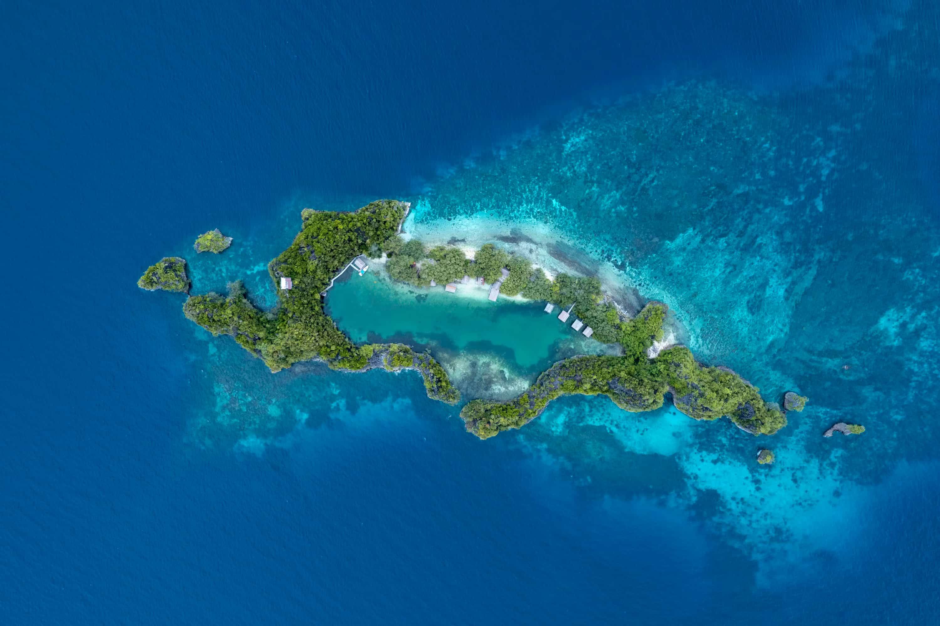 an aerial view of an island in the middle of the ocean